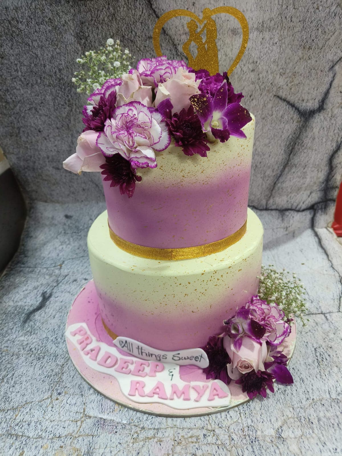 Two-tier wedding cake for Pradeep and Ramya